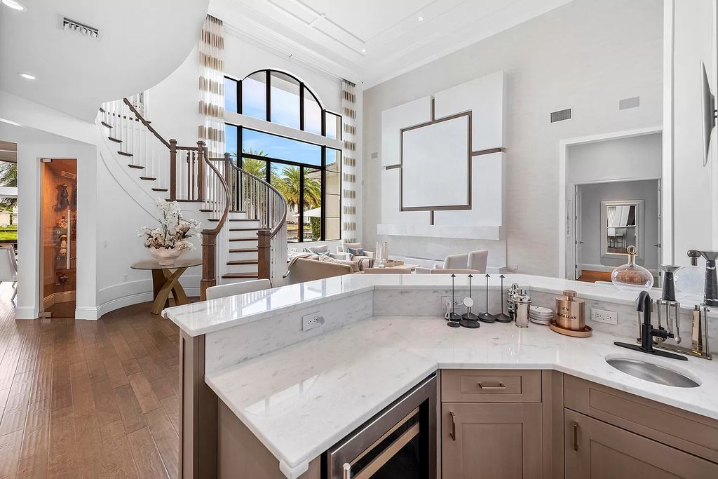The Home in Boca Raton, a an impressive two-story residence masterfully designed for luxurious living and gracious entertaining on an oversized waterfront lot within the highly desirable community of Royal Palm Polo is now available for sale. This home located at 7305 NW 27th Ave, Boca Raton, Florida
