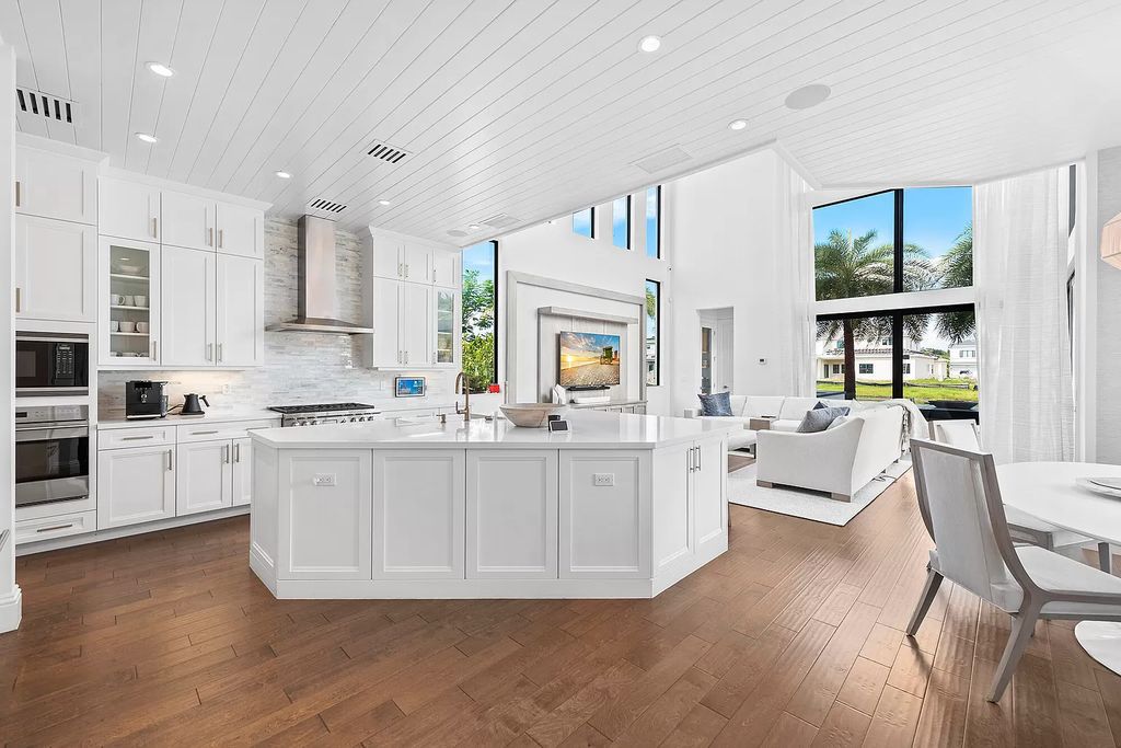 The Home in Boca Raton, a an impressive two-story residence masterfully designed for luxurious living and gracious entertaining on an oversized waterfront lot within the highly desirable community of Royal Palm Polo is now available for sale. This home located at 7305 NW 27th Ave, Boca Raton, Florida