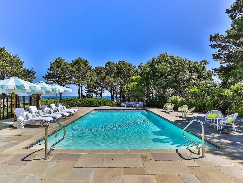 The Estate in Mashpee boasts every imaginable amenity for any occasion and total privacy with a breathtaking backdrop, now available for sale. This home located at 78 Triton Way, Mashpee, Massachusetts