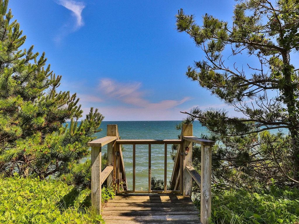 The Estate in Mashpee boasts every imaginable amenity for any occasion and total privacy with a breathtaking backdrop, now available for sale. This home located at 78 Triton Way, Mashpee, Massachusetts