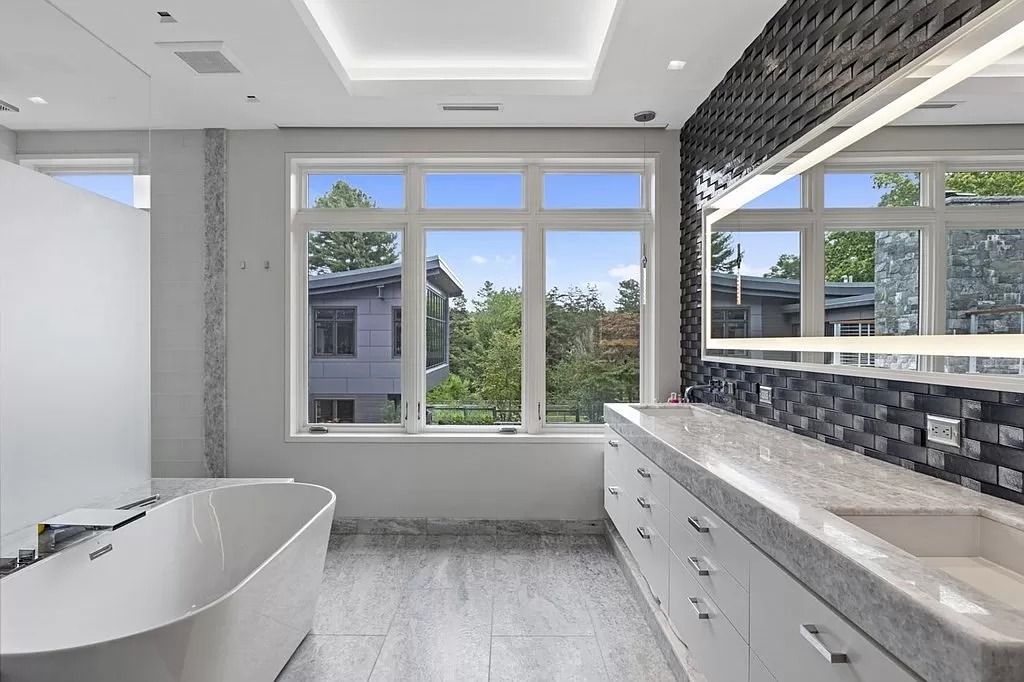 The Estate in Westwood is a luxurious home perfectly set at the end of a secluded acres now available for sale. This home located at 300 Summer St, Westwood, Massachusetts; offering 06 bedrooms and 09 bathrooms with 10,309 square feet of living spaces. 