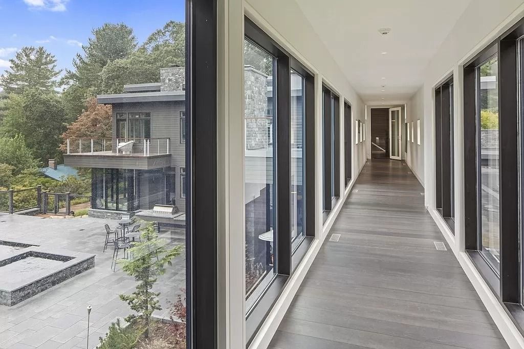 The Estate in Westwood is a luxurious home perfectly set at the end of a secluded acres now available for sale. This home located at 300 Summer St, Westwood, Massachusetts; offering 06 bedrooms and 09 bathrooms with 10,309 square feet of living spaces. 