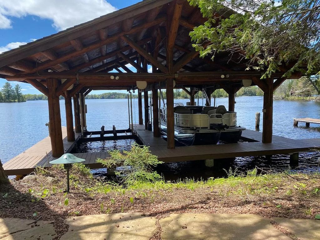 The Estate in Watersmeet is a luxurious home commanding panoramic lake views from all points now available for sale. This home located at 19210 Mamie Lake Rd W, Watersmeet, Michigan; offering 07 bedrooms and 07 bathrooms with 10,004 square feet of living spaces. 