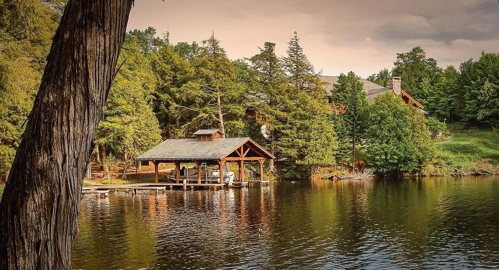 The Estate in Watersmeet is a luxurious home commanding panoramic lake views from all points now available for sale. This home located at 19210 Mamie Lake Rd W, Watersmeet, Michigan; offering 07 bedrooms and 07 bathrooms with 10,004 square feet of living spaces. 