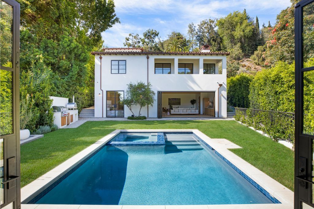The House is Hollywood Hills, a spectacular Italian inspired villa with natural light flowing through the large windows and doors, enjoy views of the city, pool, and verdant landscaping is now available for sale. This home located at 9165 Cordell Dr, Los Angeles, California