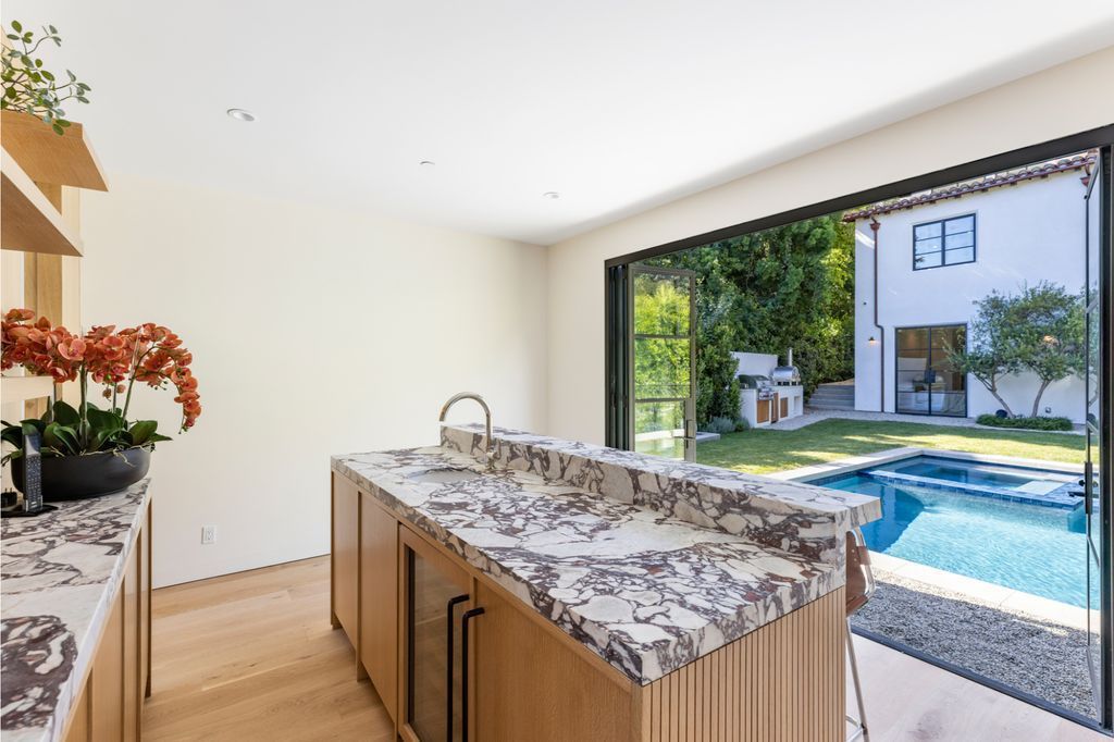 The House is Hollywood Hills, a spectacular Italian inspired villa with natural light flowing through the large windows and doors, enjoy views of the city, pool, and verdant landscaping is now available for sale. This home located at 9165 Cordell Dr, Los Angeles, California