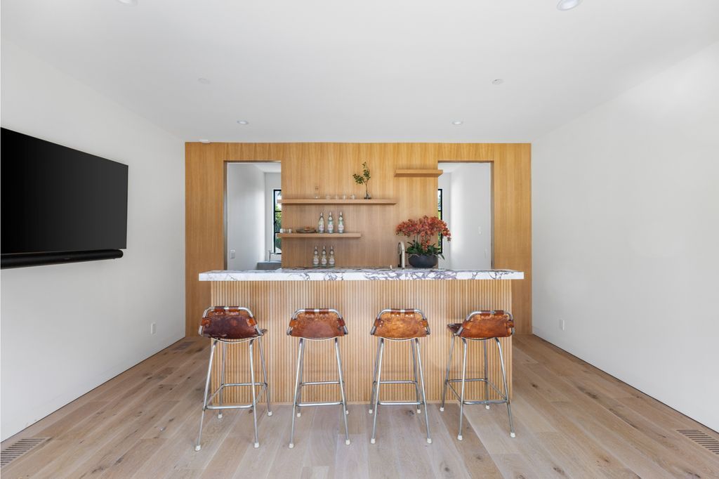 The House is Hollywood Hills, a spectacular Italian inspired villa with natural light flowing through the large windows and doors, enjoy views of the city, pool, and verdant landscaping is now available for sale. This home located at 9165 Cordell Dr, Los Angeles, California
