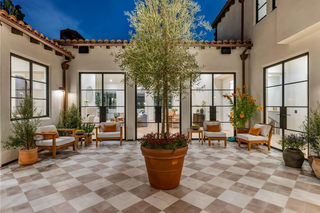 The House is Hollywood Hills, a spectacular Italian inspired villa with natural light flowing through the large windows and doors, enjoy views of the city, pool, and verdant landscaping is now available for sale. This home located at 9165 Cordell Dr, Los Angeles, California