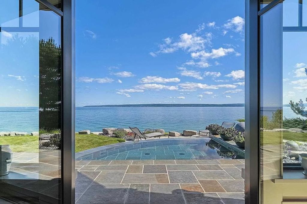 The Estate in Bay Harbor is a luxurious home featuring distinctive exterior with solid stone masonry, limestone and cedar shake, constantly maintained and consistently updated as well as incorporating current technologies and luxury now available for sale. This home located at 6494 Bay Ridge Dr, Bay Harbor, Michigan; offering 04 bedrooms and 05 bathrooms with 6,444 square feet of living spaces.