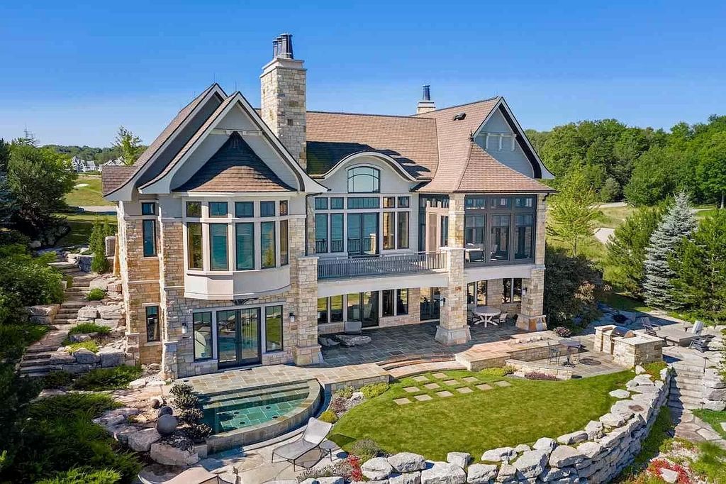 The Estate in Bay Harbor is a luxurious home featuring distinctive exterior with solid stone masonry, limestone and cedar shake, constantly maintained and consistently updated as well as incorporating current technologies and luxury now available for sale. This home located at 6494 Bay Ridge Dr, Bay Harbor, Michigan; offering 04 bedrooms and 05 bathrooms with 6,444 square feet of living spaces.