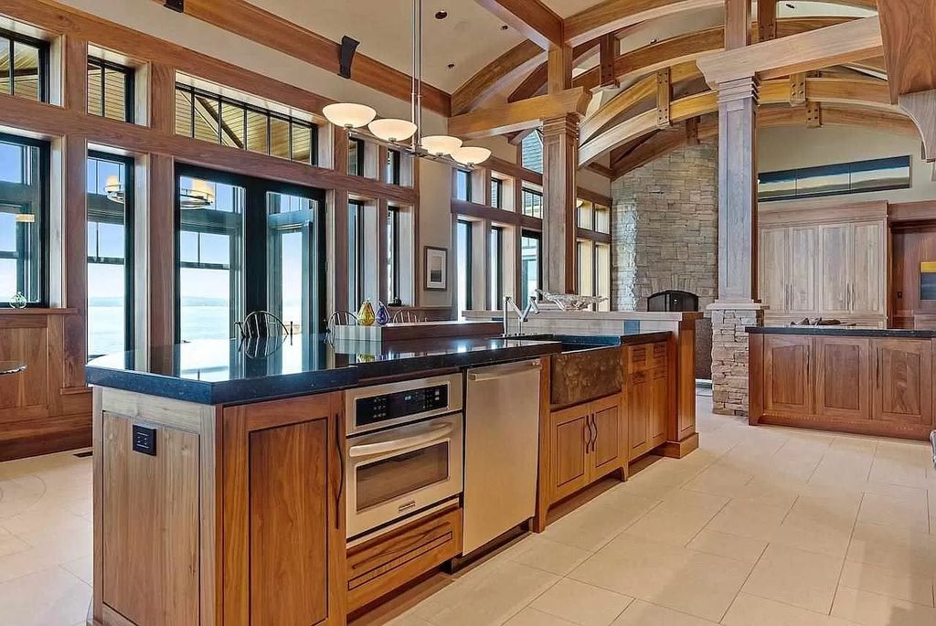 The Estate in Bay Harbor is a luxurious home featuring distinctive exterior with solid stone masonry, limestone and cedar shake, constantly maintained and consistently updated as well as incorporating current technologies and luxury now available for sale. This home located at 6494 Bay Ridge Dr, Bay Harbor, Michigan; offering 04 bedrooms and 05 bathrooms with 6,444 square feet of living spaces.