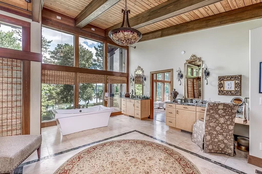 The Home in Columbus is a luxurious home with spectacular water views from almost every room, now available for sale. This home located at 6045 Round Hill Ct, Columbus, Georgia