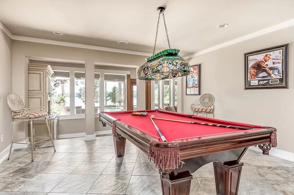 The Home in Columbus is a luxurious home with spectacular water views from almost every room, now available for sale. This home located at 6045 Round Hill Ct, Columbus, Georgia