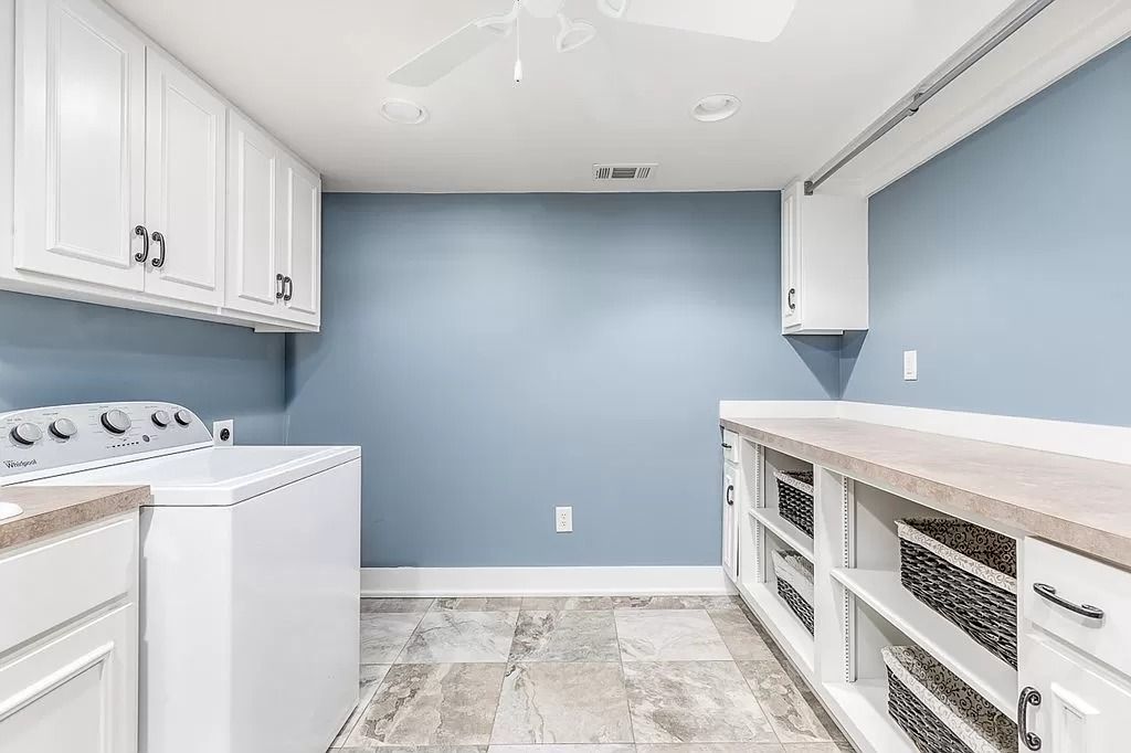 The Home in Columbus is a luxurious home with spectacular water views from almost every room, now available for sale. This home located at 6045 Round Hill Ct, Columbus, Georgia