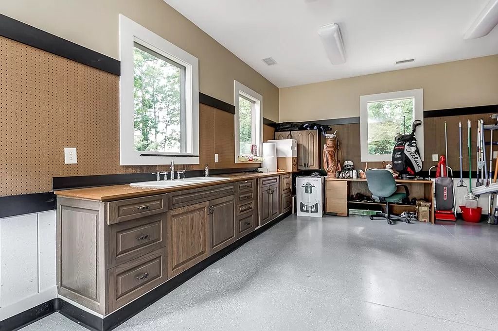 The Home in Columbus is a luxurious home with spectacular water views from almost every room, now available for sale. This home located at 6045 Round Hill Ct, Columbus, Georgia