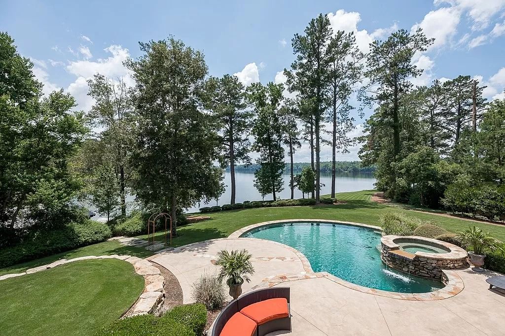 The Home in Columbus is a luxurious home with spectacular water views from almost every room, now available for sale. This home located at 6045 Round Hill Ct, Columbus, Georgia
