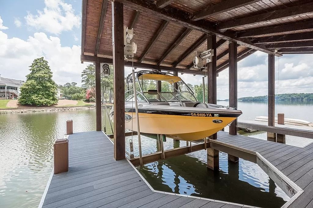 The Home in Columbus is a luxurious home with spectacular water views from almost every room, now available for sale. This home located at 6045 Round Hill Ct, Columbus, Georgia