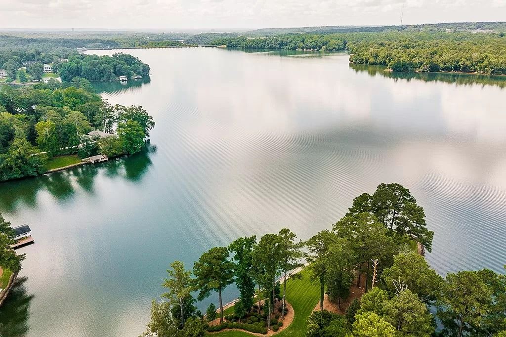 The Home in Columbus is a luxurious home with spectacular water views from almost every room, now available for sale. This home located at 6045 Round Hill Ct, Columbus, Georgia