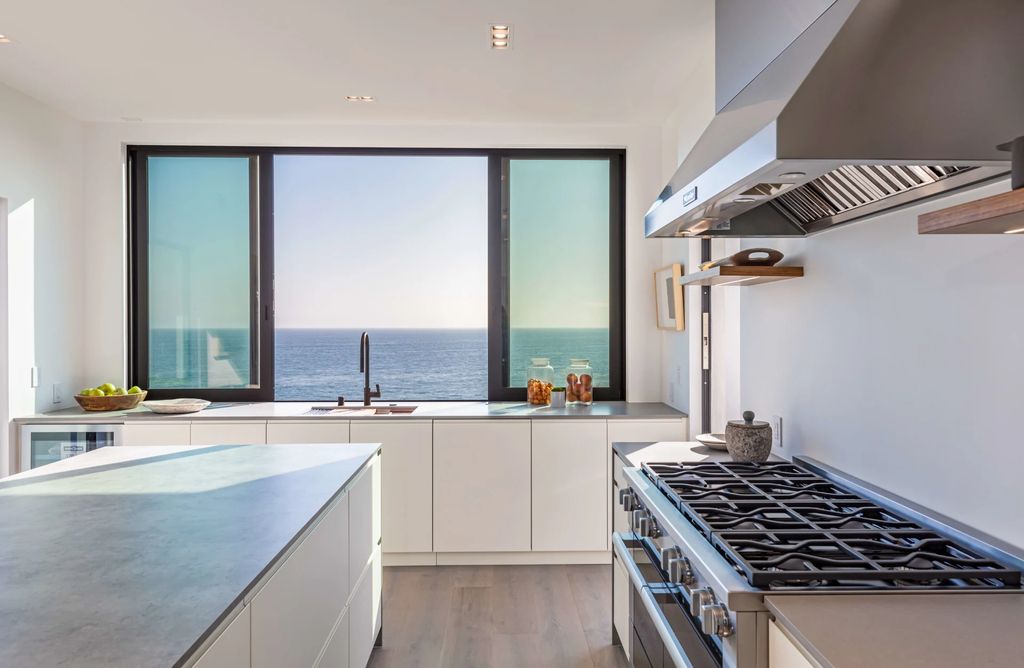 The Home in Malibu, a divine modern retreat with open-plan living spaces and entertainment-ready outdoor space offering far-reaching ocean views plus seamless access to local conveniences is now available for sale. This home located at 25225 Malibu Rd, Malibu, California