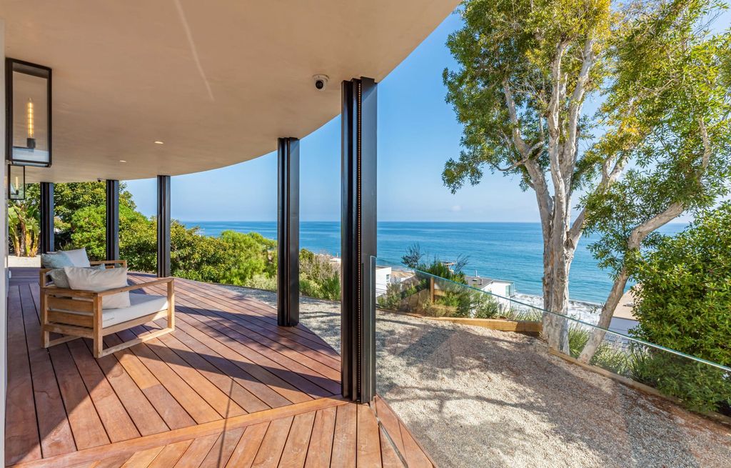 The Home in Malibu, a divine modern retreat with open-plan living spaces and entertainment-ready outdoor space offering far-reaching ocean views plus seamless access to local conveniences is now available for sale. This home located at 25225 Malibu Rd, Malibu, California