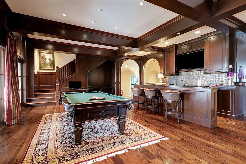 The Home in Sugar Land, a world class architectural masterpiece inspired by Europe's great estates offers endless lifestyle with opulent formals for entertaining, a gorgeous kitchen, wellness gym, two game rooms, wet bars, media room and other entertainment amenities is now available for sale. This home located at 11 Paradise Point Dr, Sugar Land, Texas