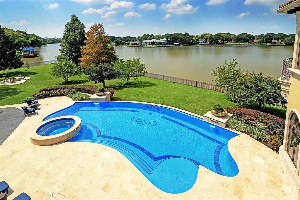 The Home in Sugar Land, a world class architectural masterpiece inspired by Europe's great estates offers endless lifestyle with opulent formals for entertaining, a gorgeous kitchen, wellness gym, two game rooms, wet bars, media room and other entertainment amenities is now available for sale. This home located at 11 Paradise Point Dr, Sugar Land, Texas