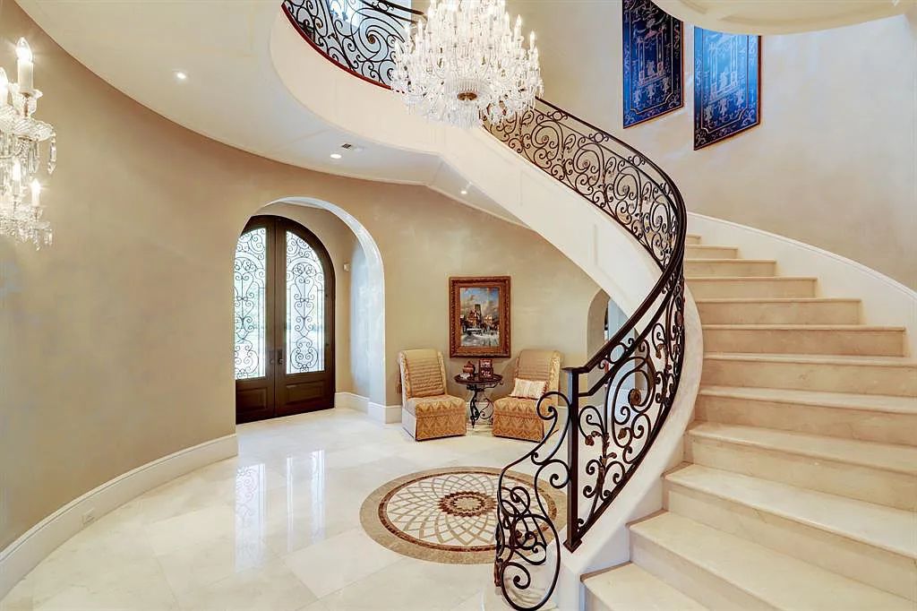 The Home in Sugar Land, a world class architectural masterpiece inspired by Europe's great estates offers endless lifestyle with opulent formals for entertaining, a gorgeous kitchen, wellness gym, two game rooms, wet bars, media room and other entertainment amenities is now available for sale. This home located at 11 Paradise Point Dr, Sugar Land, Texas