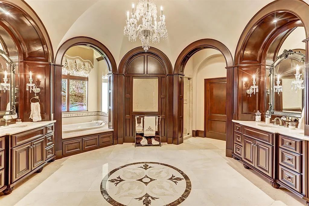 The Home in Sugar Land, a world class architectural masterpiece inspired by Europe's great estates offers endless lifestyle with opulent formals for entertaining, a gorgeous kitchen, wellness gym, two game rooms, wet bars, media room and other entertainment amenities is now available for sale. This home located at 11 Paradise Point Dr, Sugar Land, Texas