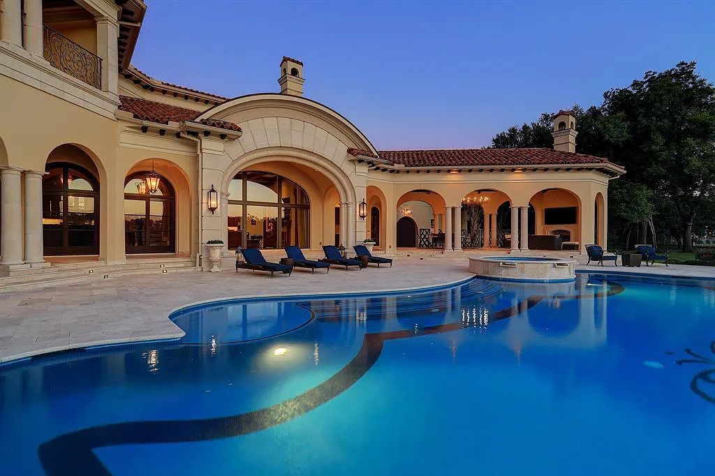 The Home in Sugar Land, a world class architectural masterpiece inspired by Europe's great estates offers endless lifestyle with opulent formals for entertaining, a gorgeous kitchen, wellness gym, two game rooms, wet bars, media room and other entertainment amenities is now available for sale. This home located at 11 Paradise Point Dr, Sugar Land, Texas
