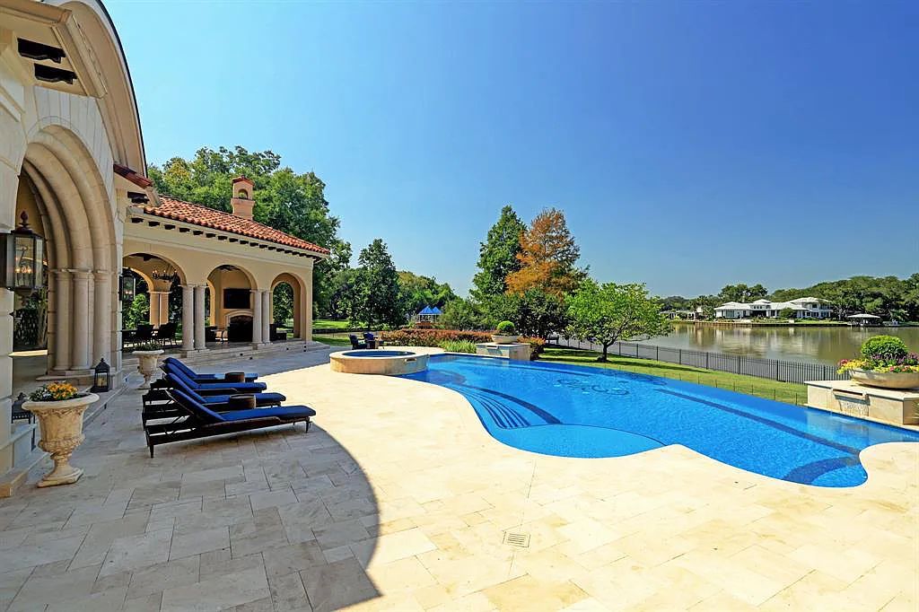 The Home in Sugar Land, a world class architectural masterpiece inspired by Europe's great estates offers endless lifestyle with opulent formals for entertaining, a gorgeous kitchen, wellness gym, two game rooms, wet bars, media room and other entertainment amenities is now available for sale. This home located at 11 Paradise Point Dr, Sugar Land, Texas