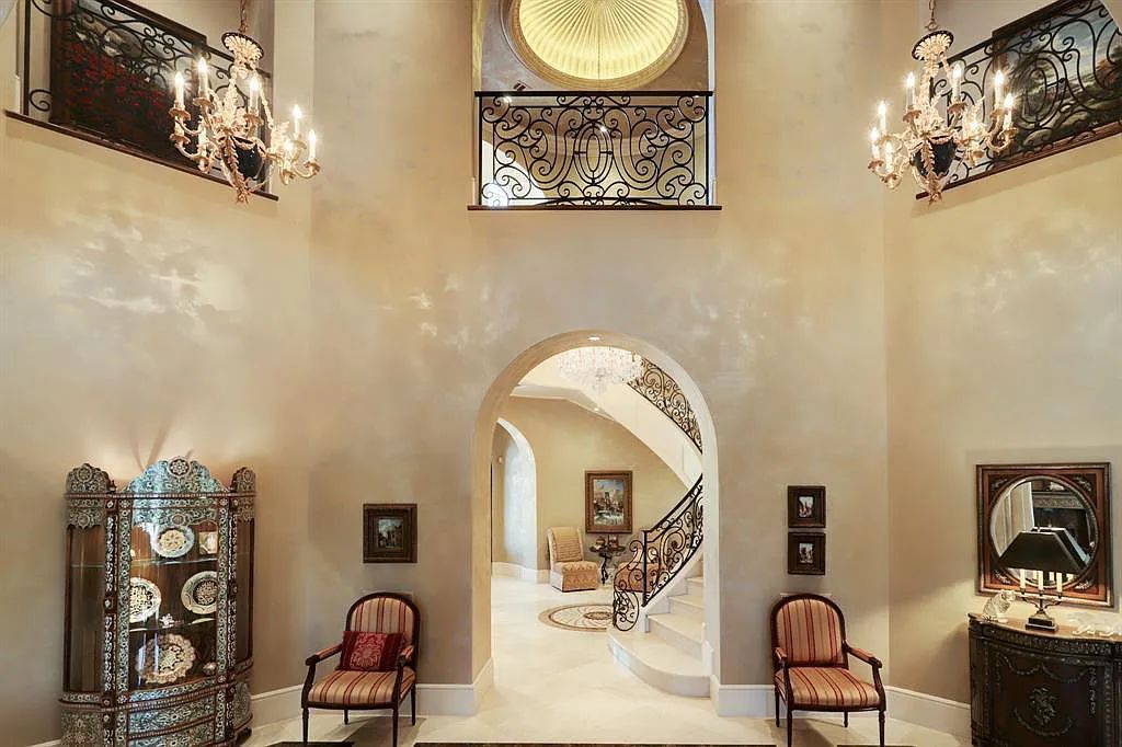The Home in Sugar Land, a world class architectural masterpiece inspired by Europe's great estates offers endless lifestyle with opulent formals for entertaining, a gorgeous kitchen, wellness gym, two game rooms, wet bars, media room and other entertainment amenities is now available for sale. This home located at 11 Paradise Point Dr, Sugar Land, Texas