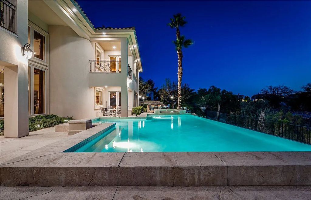 The Home in Henderson, an elegant Terracina estate with classic finishes in a prestigious guard-gated community offers panoramic mountain, sprawling golf course, city, and Strip views is now available for sale. This home located at 2608 Ragusa Ct, Henderson, Nevada