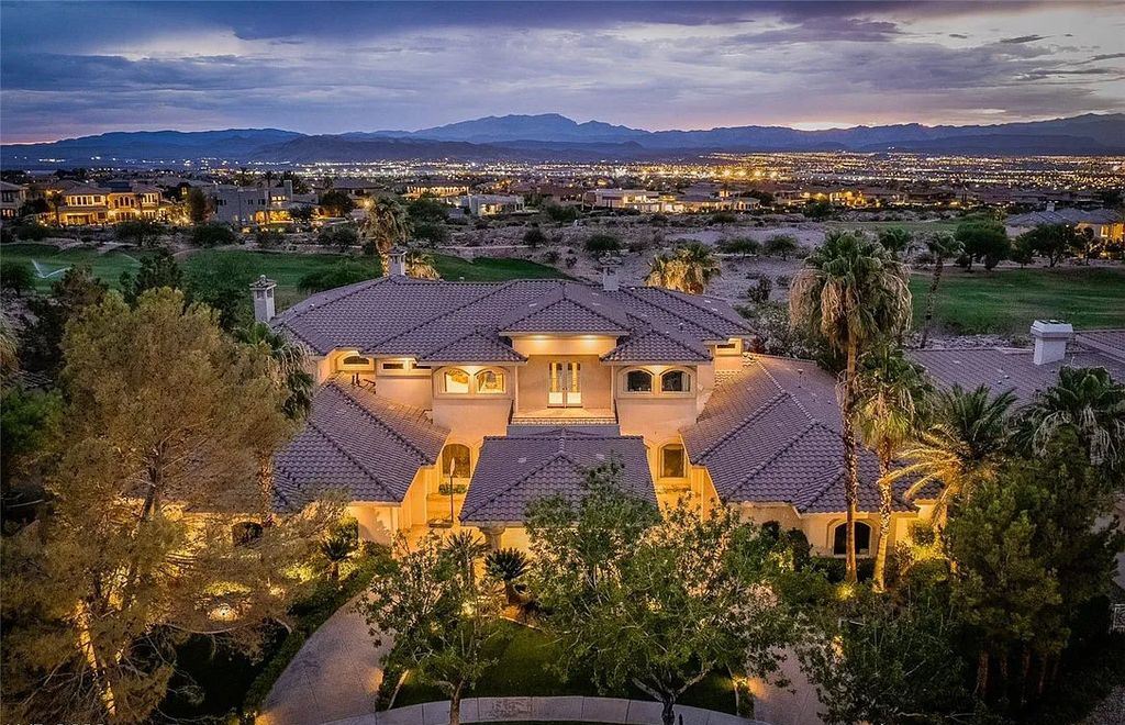 The Home in Henderson, an elegant Terracina estate with classic finishes in a prestigious guard-gated community offers panoramic mountain, sprawling golf course, city, and Strip views is now available for sale. This home located at 2608 Ragusa Ct, Henderson, Nevada