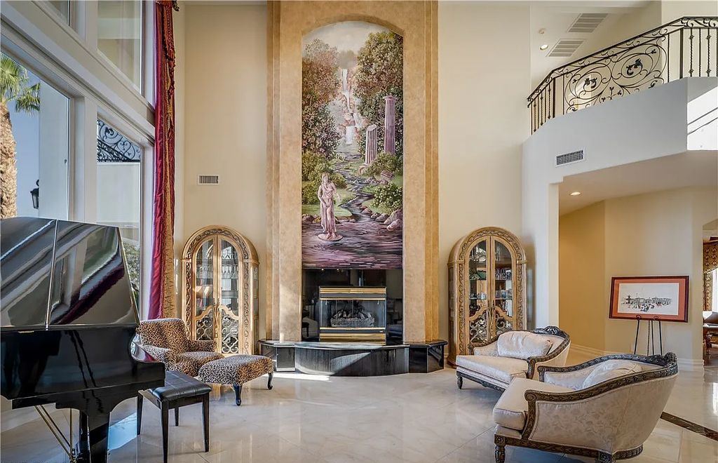 The Home in Henderson, an elegant Terracina estate with classic finishes in a prestigious guard-gated community offers panoramic mountain, sprawling golf course, city, and Strip views is now available for sale. This home located at 2608 Ragusa Ct, Henderson, Nevada