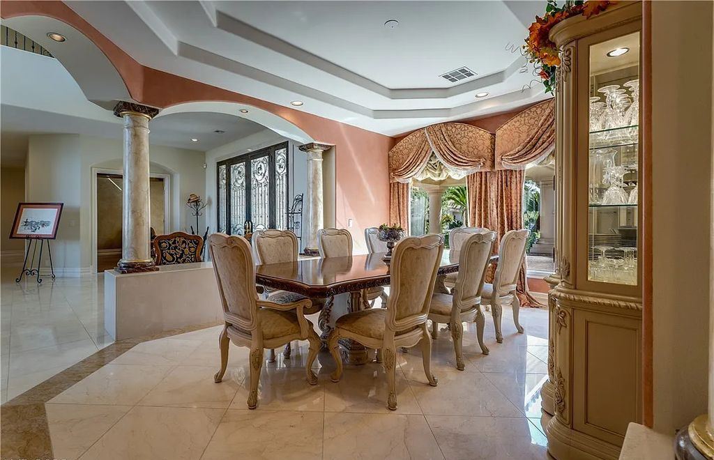 The Home in Henderson, an elegant Terracina estate with classic finishes in a prestigious guard-gated community offers panoramic mountain, sprawling golf course, city, and Strip views is now available for sale. This home located at 2608 Ragusa Ct, Henderson, Nevada