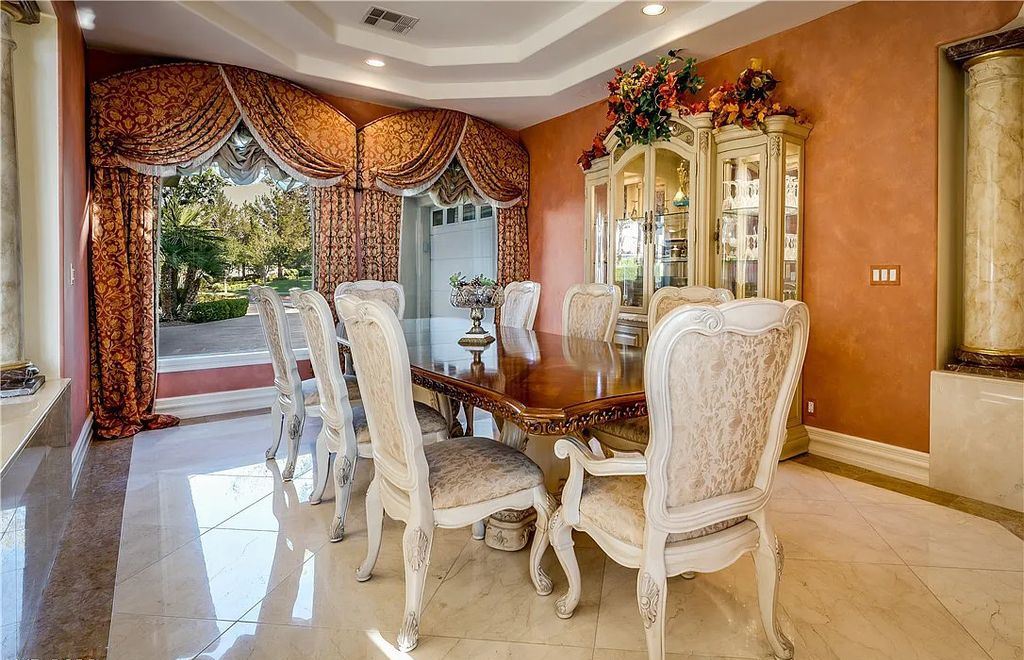 The Home in Henderson, an elegant Terracina estate with classic finishes in a prestigious guard-gated community offers panoramic mountain, sprawling golf course, city, and Strip views is now available for sale. This home located at 2608 Ragusa Ct, Henderson, Nevada