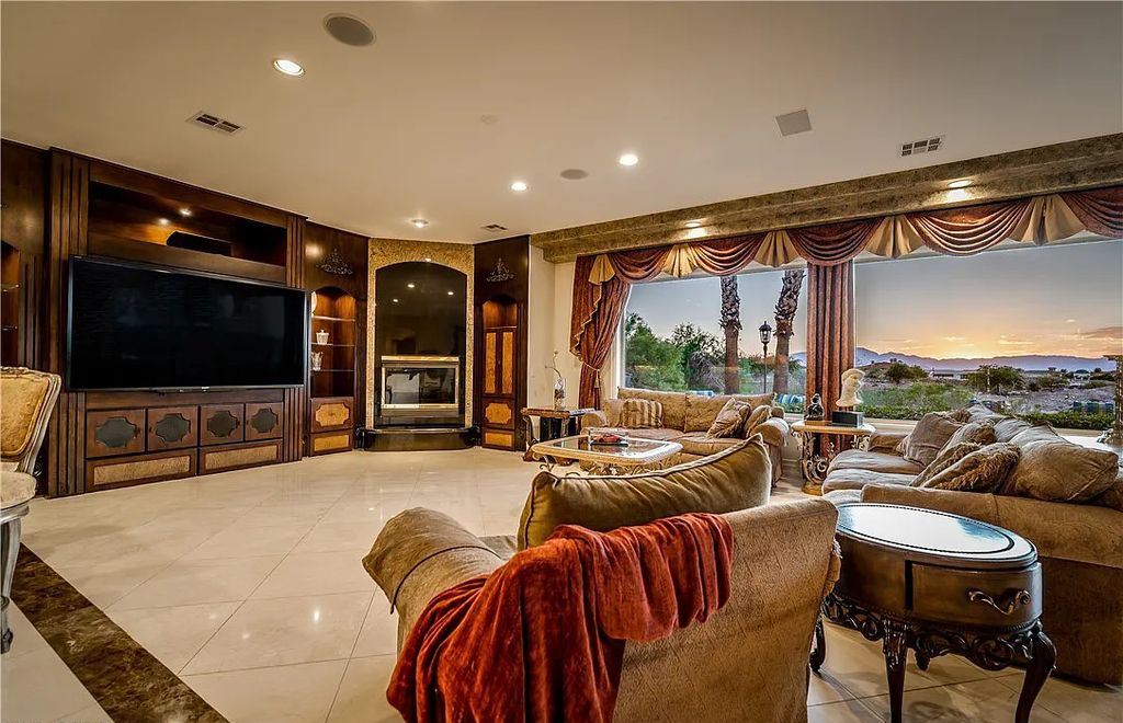 The Home in Henderson, an elegant Terracina estate with classic finishes in a prestigious guard-gated community offers panoramic mountain, sprawling golf course, city, and Strip views is now available for sale. This home located at 2608 Ragusa Ct, Henderson, Nevada