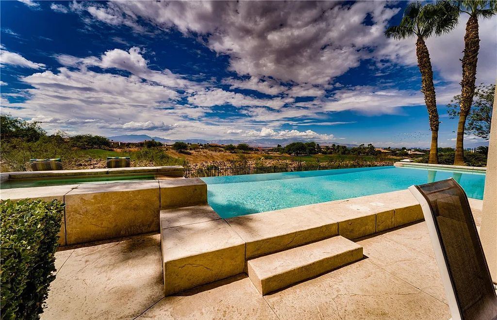 The Home in Henderson, an elegant Terracina estate with classic finishes in a prestigious guard-gated community offers panoramic mountain, sprawling golf course, city, and Strip views is now available for sale. This home located at 2608 Ragusa Ct, Henderson, Nevada
