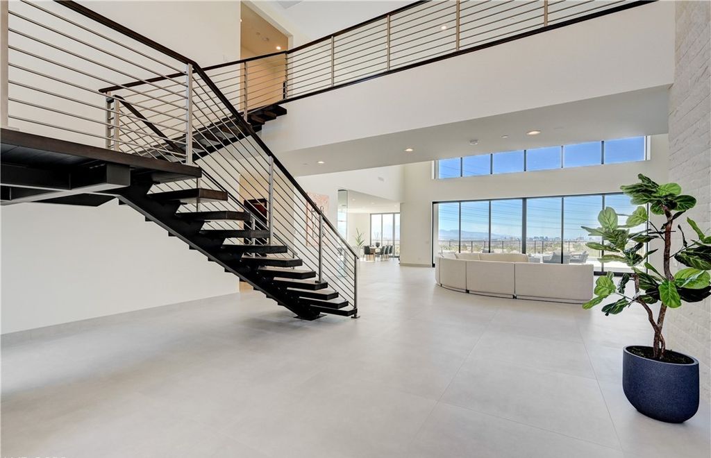 The Home in Henderson, a brand new construction features an open floor plan with modern finishes boasting unobstructed Vegas Strip and mountain views is now available for sale. This home located at 2281 Laughing Water Way, Henderson, Nevada