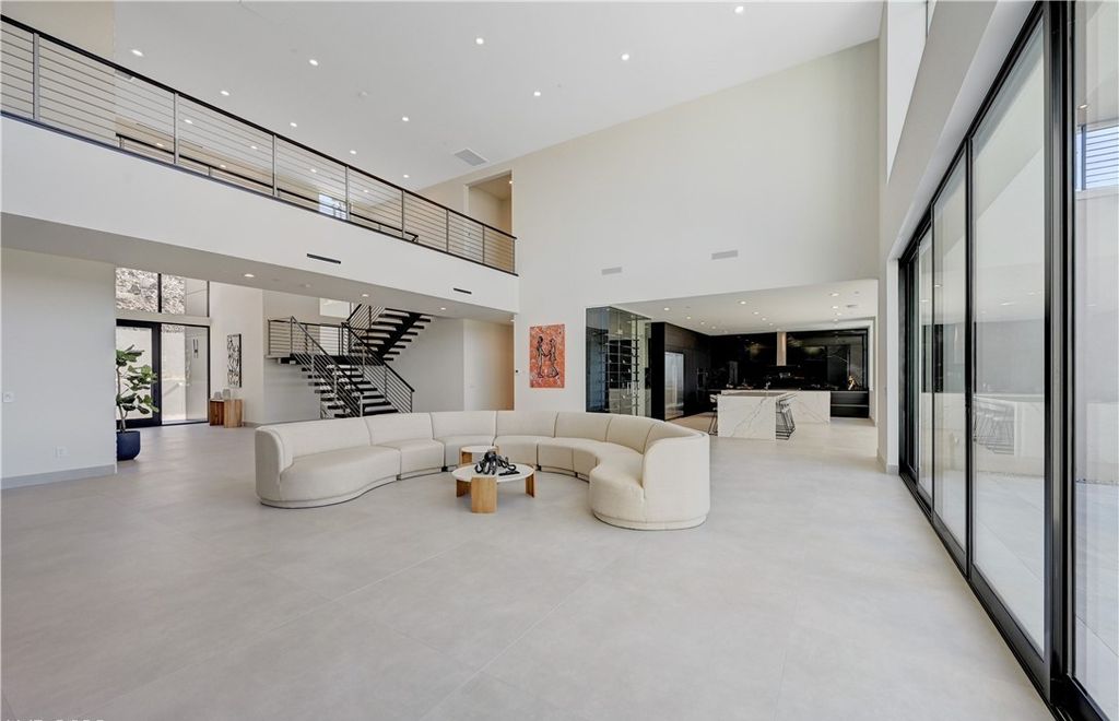 The Home in Henderson, a brand new construction features an open floor plan with modern finishes boasting unobstructed Vegas Strip and mountain views is now available for sale. This home located at 2281 Laughing Water Way, Henderson, Nevada
