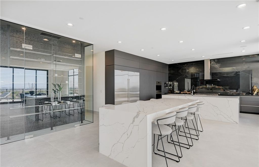 The Home in Henderson, a brand new construction features an open floor plan with modern finishes boasting unobstructed Vegas Strip and mountain views is now available for sale. This home located at 2281 Laughing Water Way, Henderson, Nevada