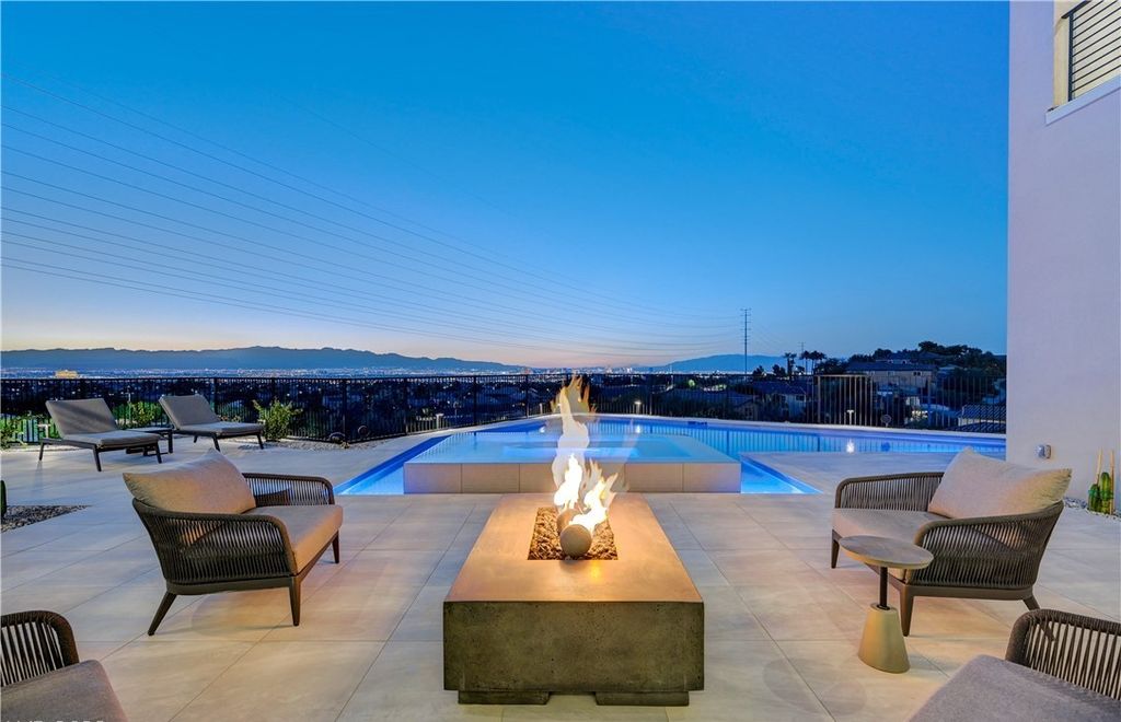 The Home in Henderson, a brand new construction features an open floor plan with modern finishes boasting unobstructed Vegas Strip and mountain views is now available for sale. This home located at 2281 Laughing Water Way, Henderson, Nevada