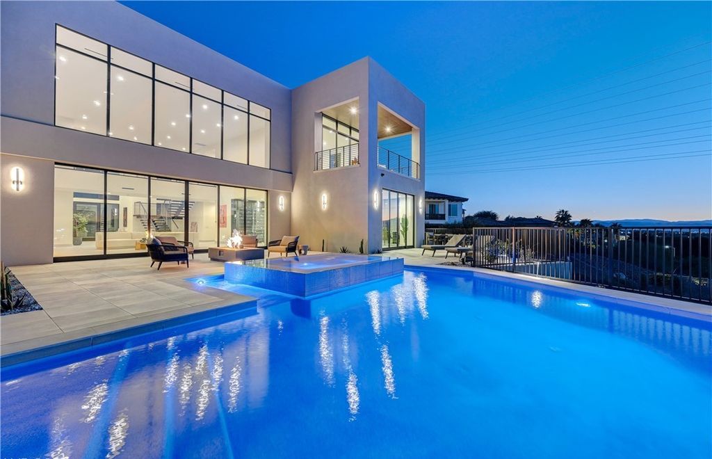 The Home in Henderson, a brand new construction features an open floor plan with modern finishes boasting unobstructed Vegas Strip and mountain views is now available for sale. This home located at 2281 Laughing Water Way, Henderson, Nevada