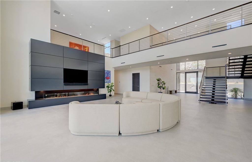 The Home in Henderson, a brand new construction features an open floor plan with modern finishes boasting unobstructed Vegas Strip and mountain views is now available for sale. This home located at 2281 Laughing Water Way, Henderson, Nevada