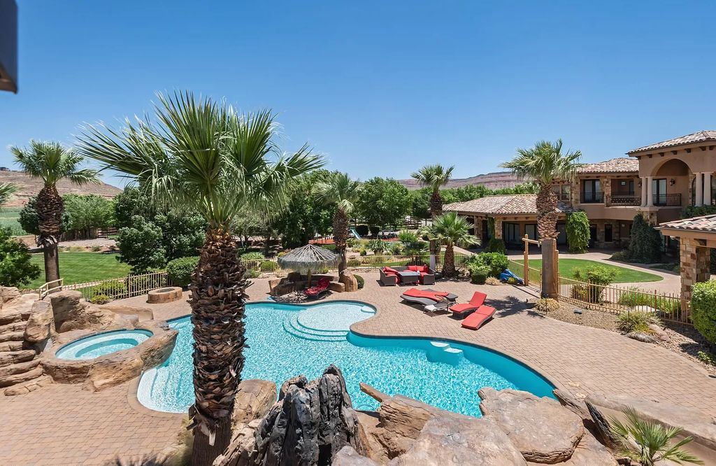 The Estate in Washington, a luxurious home with over 0.5 acre pond plenty of space for parking offering resort style pool, full sports court, theatre room, indoor gym, full bar, pavillion & indoor basketball court and  is now available for sale. This home located at 90 W Triple Crown Ln, Washington, Utah
