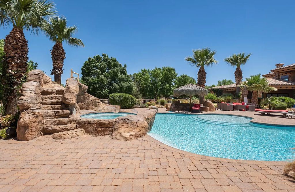 The Estate in Washington, a luxurious home with over 0.5 acre pond plenty of space for parking offering resort style pool, full sports court, theatre room, indoor gym, full bar, pavillion & indoor basketball court and  is now available for sale. This home located at 90 W Triple Crown Ln, Washington, Utah
