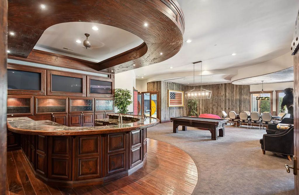 The Estate in Washington, a luxurious home with over 0.5 acre pond plenty of space for parking offering resort style pool, full sports court, theatre room, indoor gym, full bar, pavillion & indoor basketball court and  is now available for sale. This home located at 90 W Triple Crown Ln, Washington, Utah