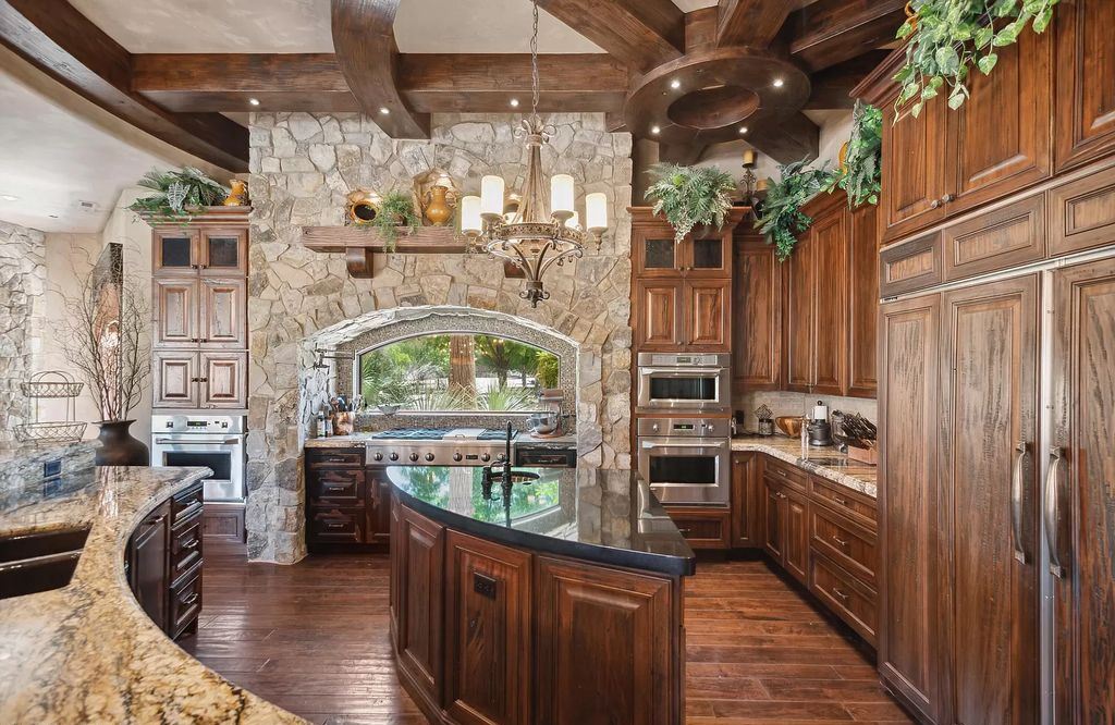 The Estate in Washington, a luxurious home with over 0.5 acre pond plenty of space for parking offering resort style pool, full sports court, theatre room, indoor gym, full bar, pavillion & indoor basketball court and  is now available for sale. This home located at 90 W Triple Crown Ln, Washington, Utah
