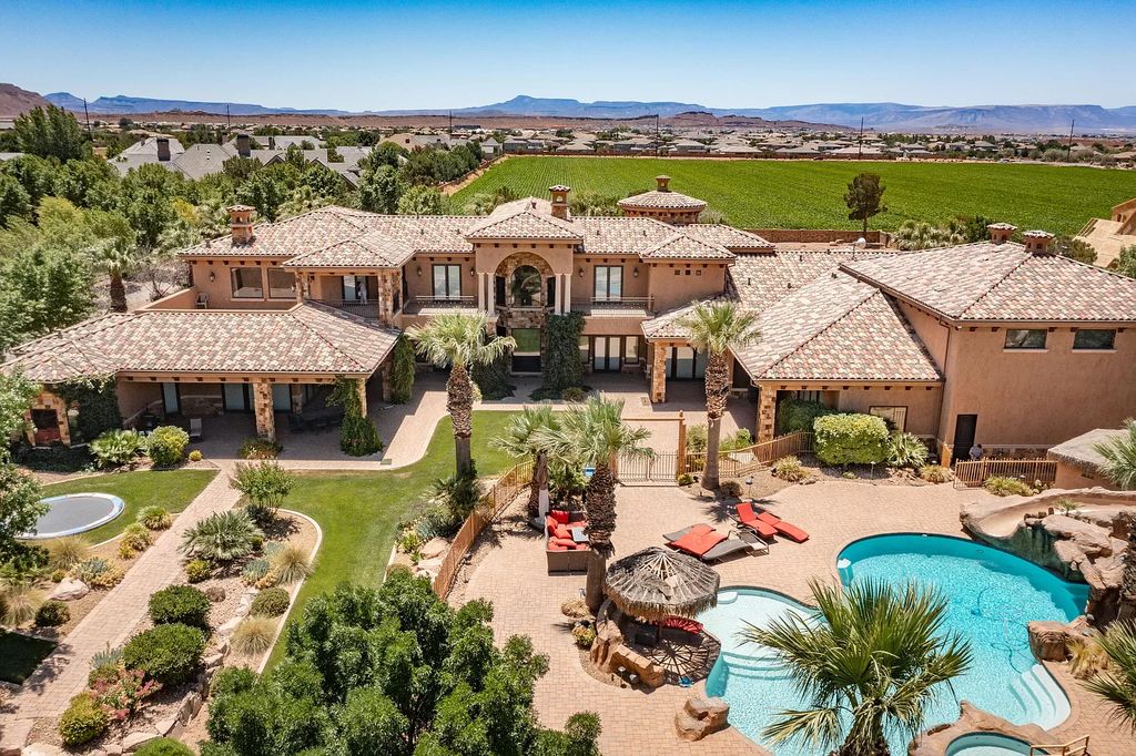 The Estate in Washington, a luxurious home with over 0.5 acre pond plenty of space for parking offering resort style pool, full sports court, theatre room, indoor gym, full bar, pavillion & indoor basketball court and  is now available for sale. This home located at 90 W Triple Crown Ln, Washington, Utah