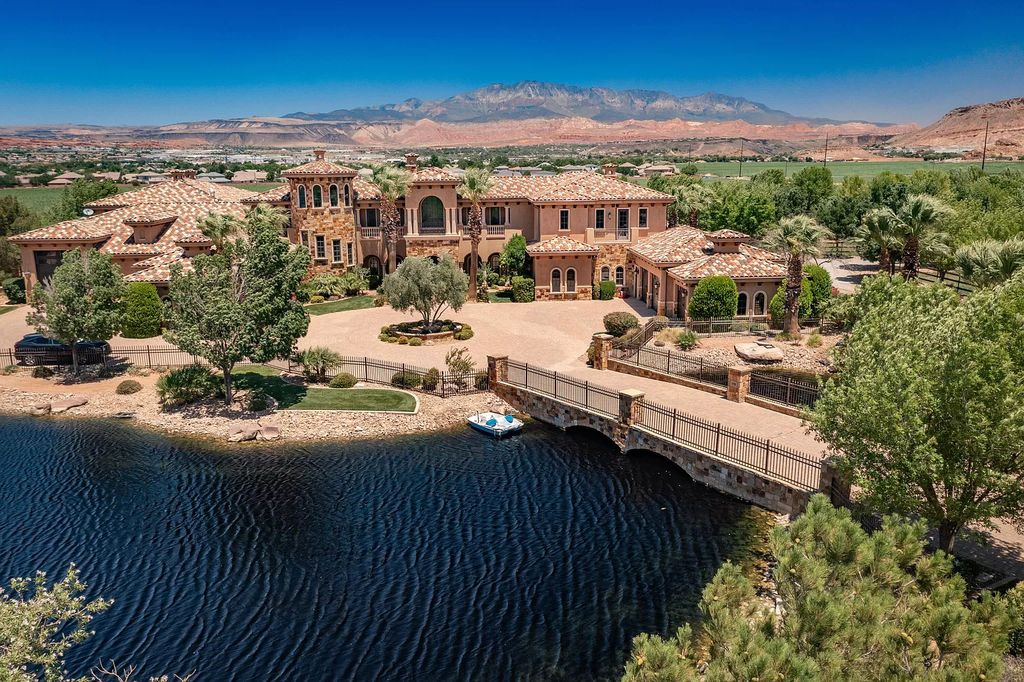 The Estate in Washington, a luxurious home with over 0.5 acre pond plenty of space for parking offering resort style pool, full sports court, theatre room, indoor gym, full bar, pavillion & indoor basketball court and  is now available for sale. This home located at 90 W Triple Crown Ln, Washington, Utah
